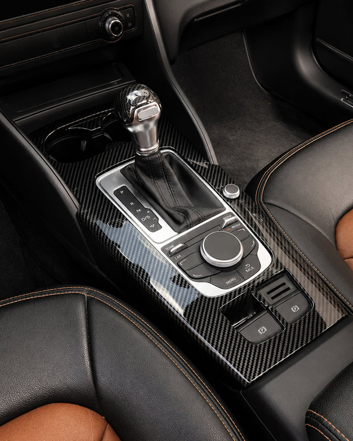 Car interior with a gear shift and carbon fiber accents
