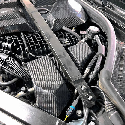 Engine bay cover carbon side in car close up